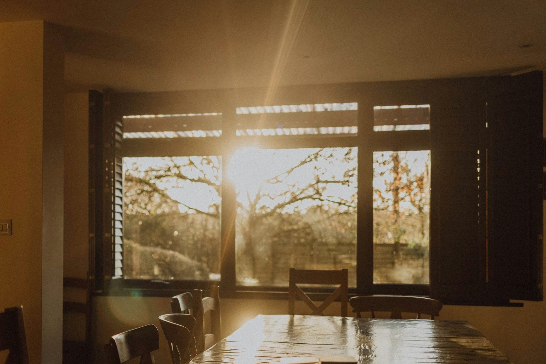 a room with a window that has sun glare